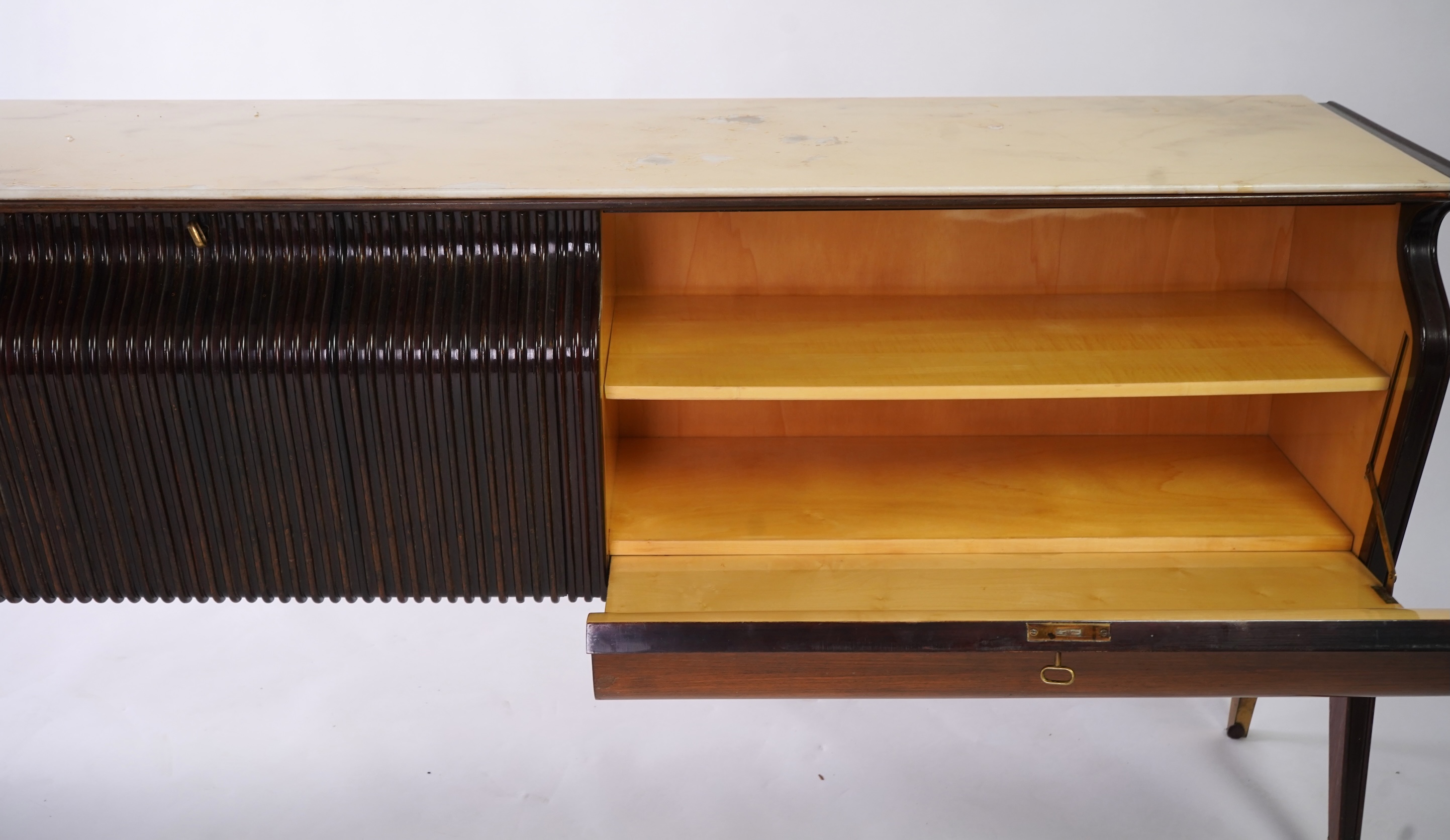 Osvaldo Borsani (Italian, 1911-1985) for Atelier Borsani Varedo: A large Indian rosewood and mahogany credenza, 276.5cm wide x 49cm deep x 94cm high